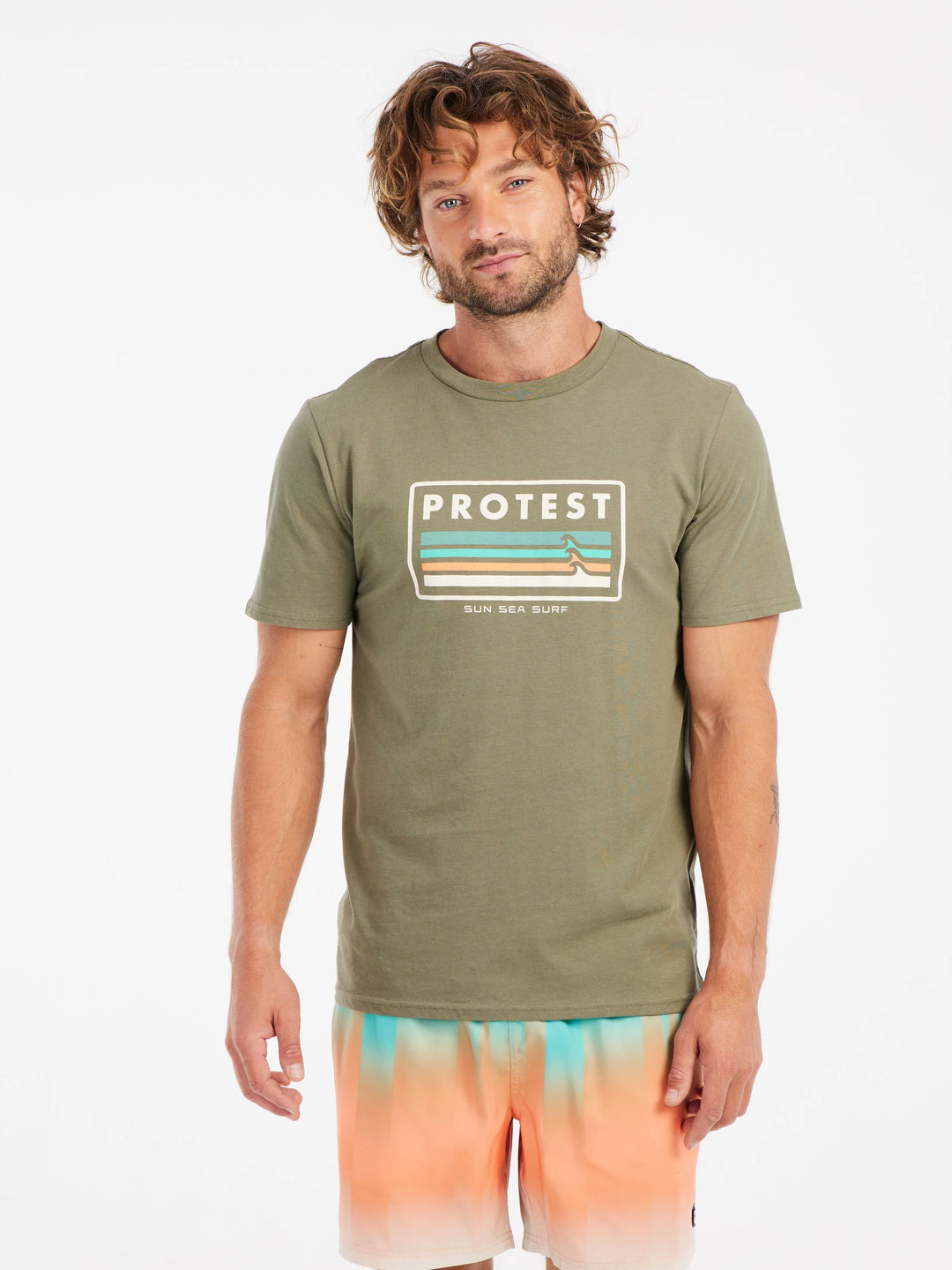 Man wearing a green t-shirt with 'PROTEST' printed on it against a white background